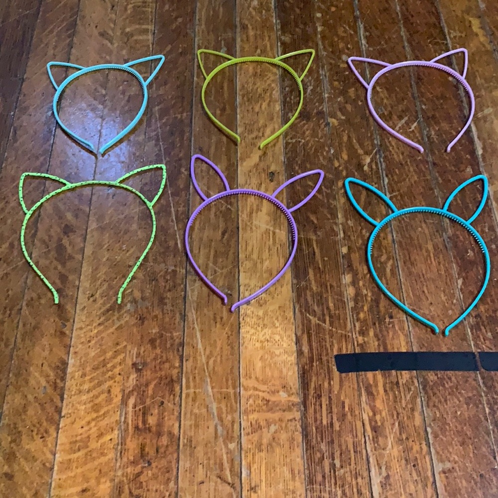 Headbands,plastic,1 isn’t plastic,4of them are cat ears 2 of them are bunny ears